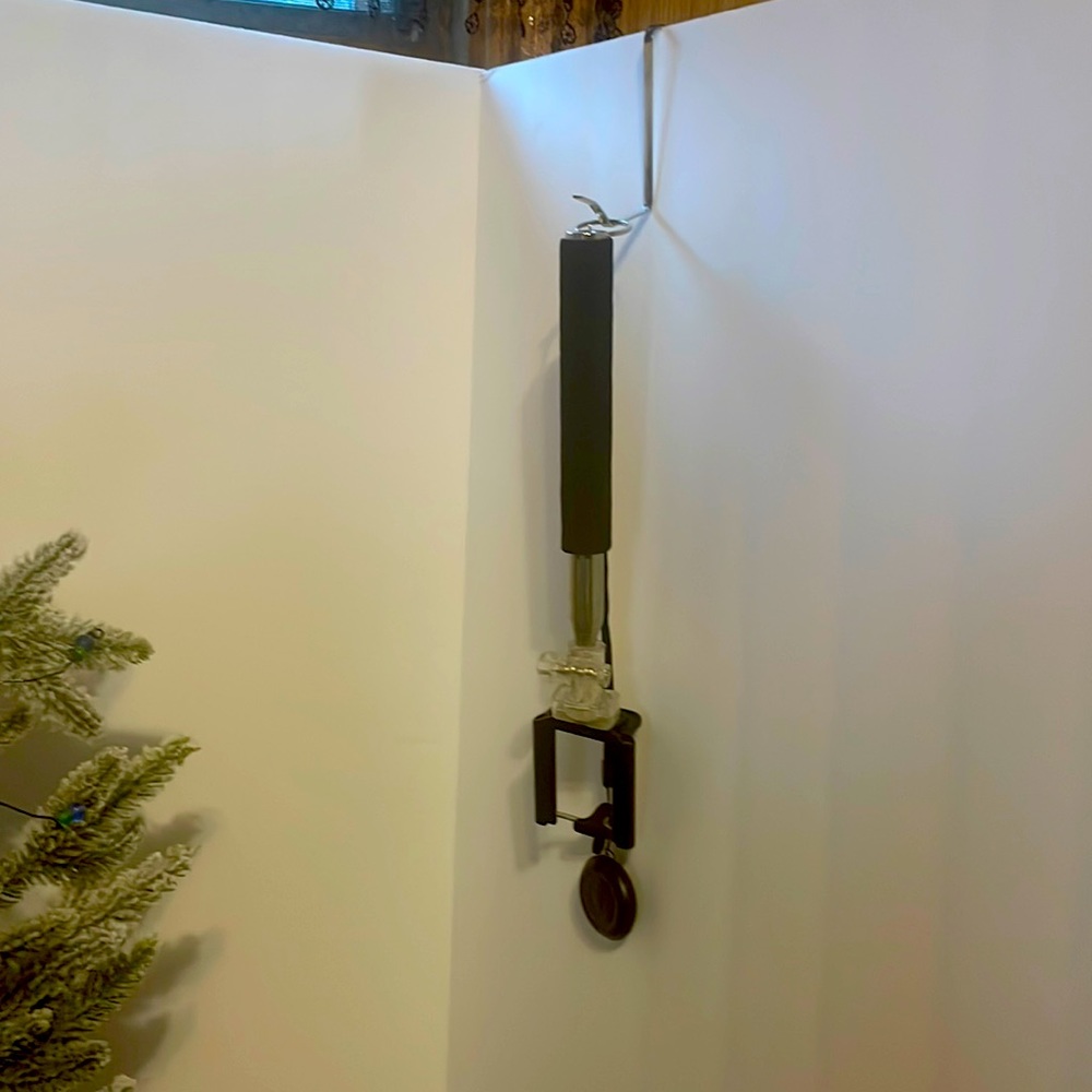 Selfie stick with button on handle. Extends to 3.5 feet.